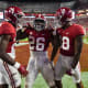 Alabama Crimson Tide running back Jamarion Miller (26) celebrates with wide receiver/running back Emmanuel Henderson Jr. (24) and wide receiver Shazz Preston (18) after scoring a touchdown against the Vanderbilt Commodores at Bryant-Denny Stadium. Alabama won 55-3.